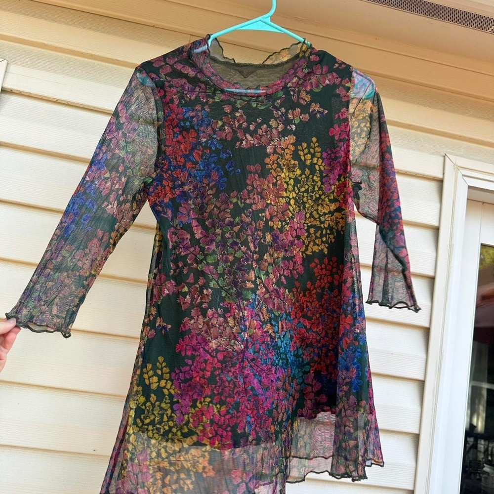 Sheer floral mesh long sleeve top with lettuce hem details